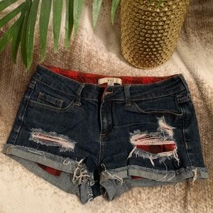 Dark wash distressed jean shorts
